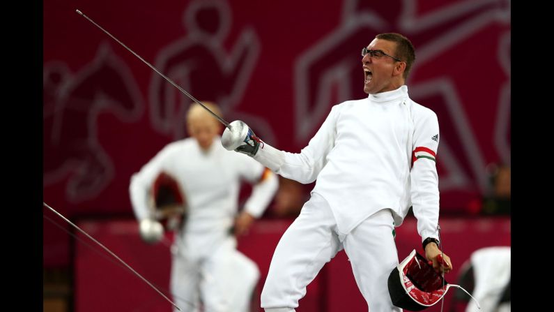 Hungary's Adam Marosi celebrates winning a fencing bout during the men's modern pentathlon.