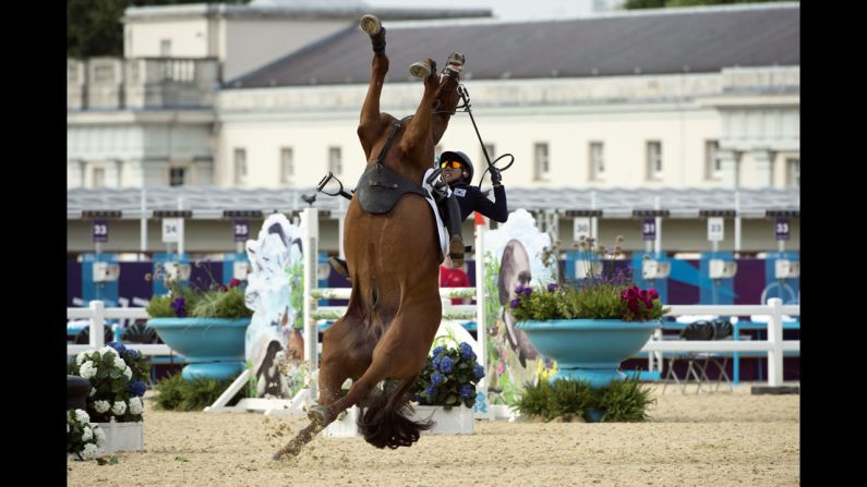 South Korea's Woojin Hwang loses control of his horse during the show jumping event of the modern pentathlon.