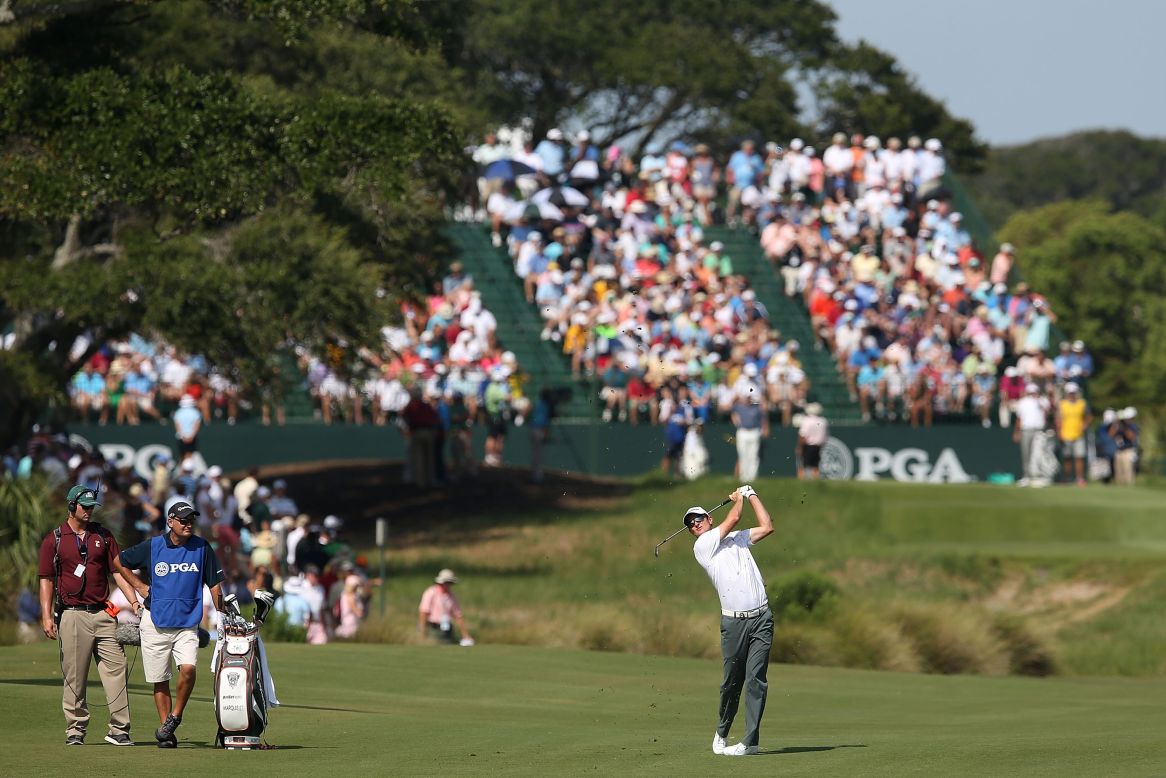 Justin Rose of England hits a shot off the first fairway during round three on Saturday.