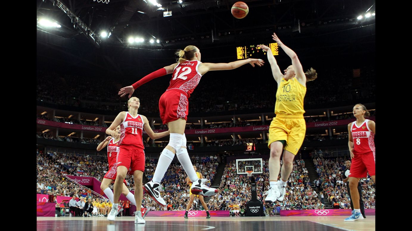 No. 10 Kristi Harrower, of Australia, attempts a shot in the first half against No. 12 Irina Osipova, of Russia, during the women's basketball bronze medal game.