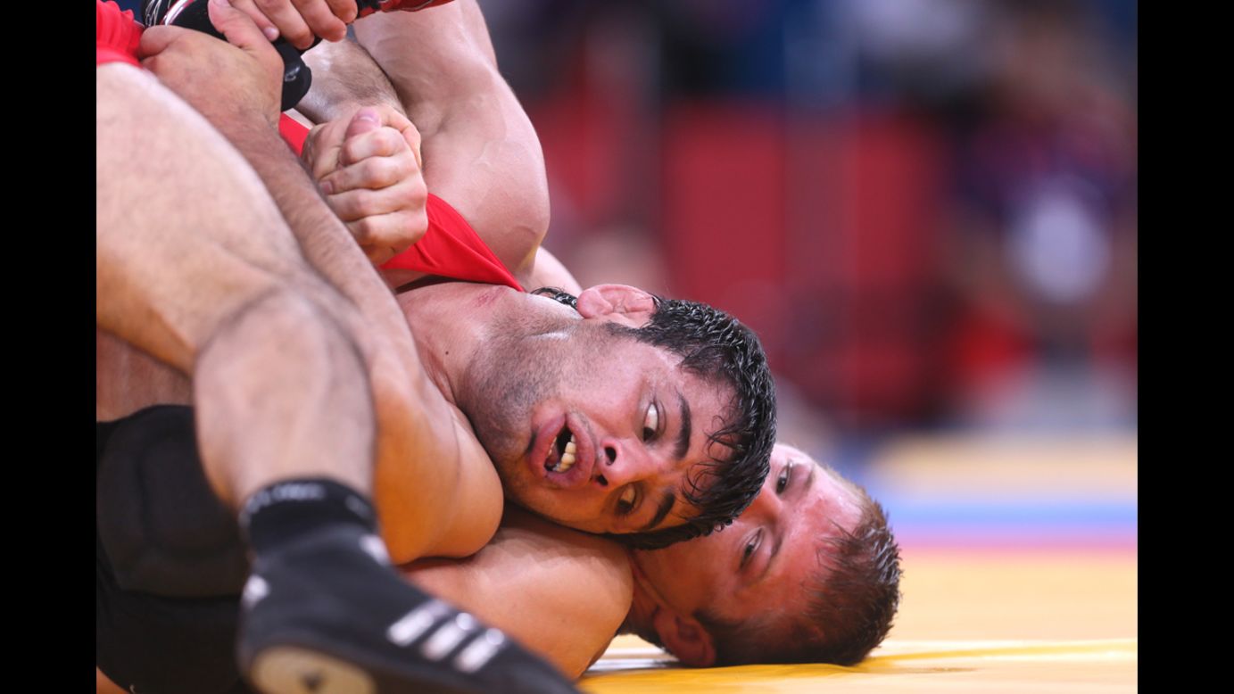 Turkey's Ibrahim Bolukbasi, left, wrestles the United States' Jake Herbert in the men's freestyle wrestling match.