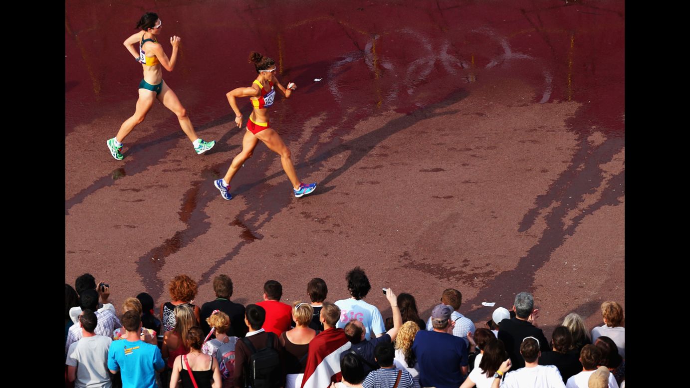 Spain's Beatriz Pascual races Australia's Regan Lamble during the women's 20-kilometer walk.