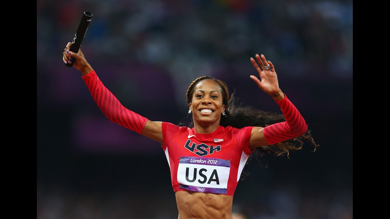 Sanya Richards-Ross of crosses the finish line to win gold for her team.