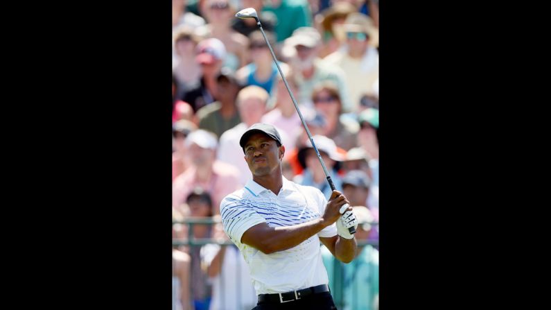 Tiger Woods of the United States hits off the first tee.