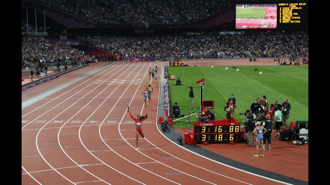 Sanya Richards-Ross of the United States is triumphant as she crosses the finish line.