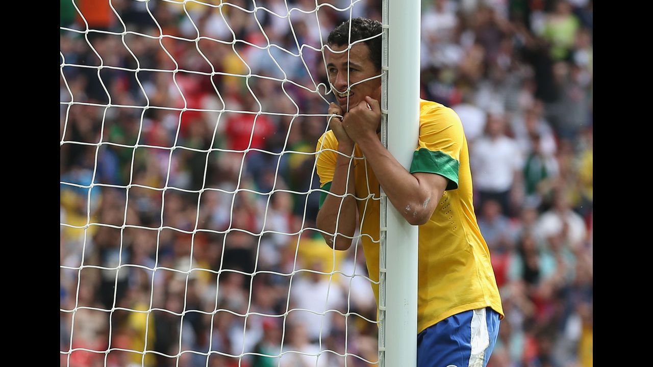 Leandro Damiao of Brazil waits for his mother to let him out of timeout.