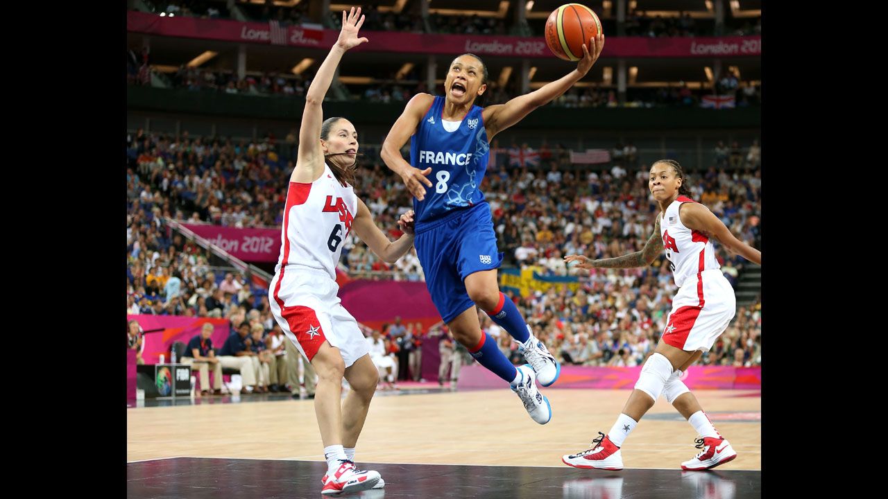  France's Edwige Lawson-Wade, in blue, goes up for a shot against Sue Bird in the second half.