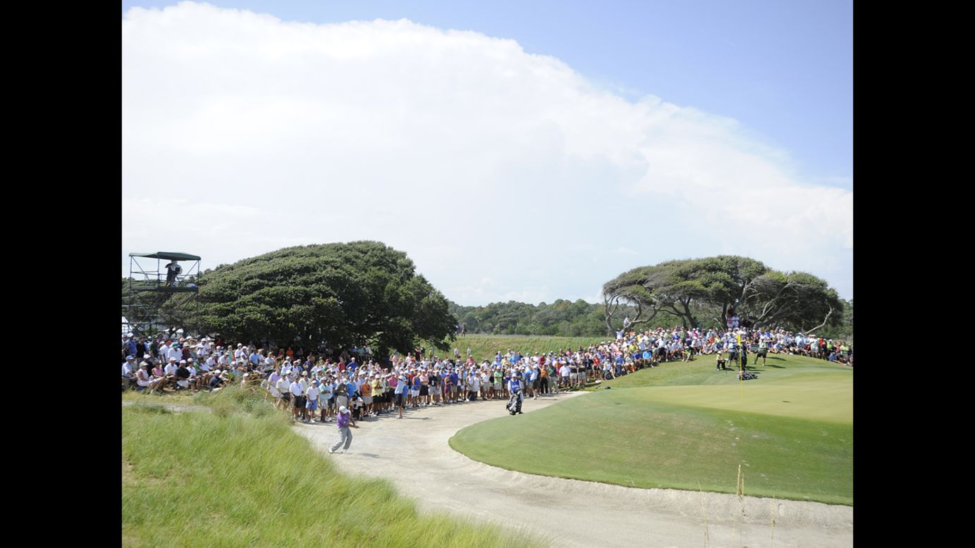 Fans watch the pairing of Graeme McDowell and Phil Mickelson on Saturday.