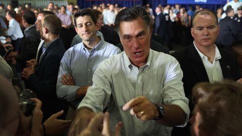 Ryan looks on as Romney greets people June 18, 2012, during a campaign event in Janesville, Wisconsin.