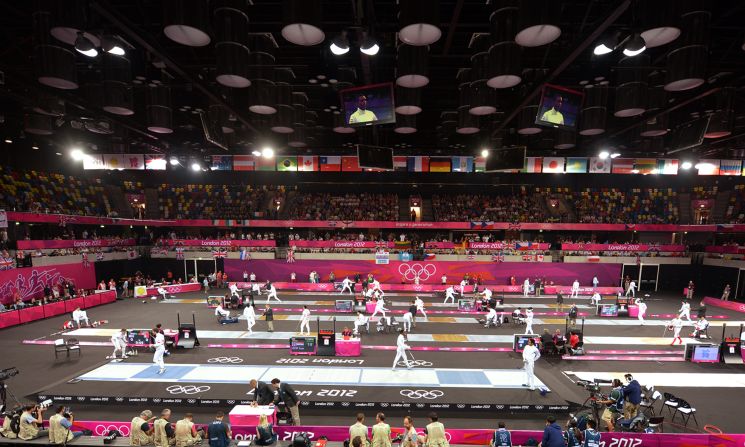 Athletes compete in fencing during part of the modern pentathlon.