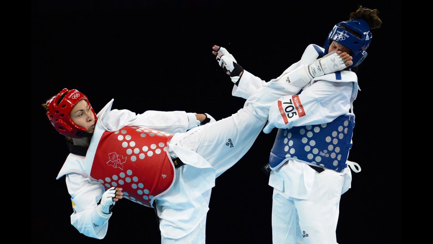 Maryna Konieva of Ukraine, left, competes against Nadin Dawani of Jordan during the women's +67-kilogram taekwondo preliminary round. Konieva defeated Dawani to advance to the quarterfinals.