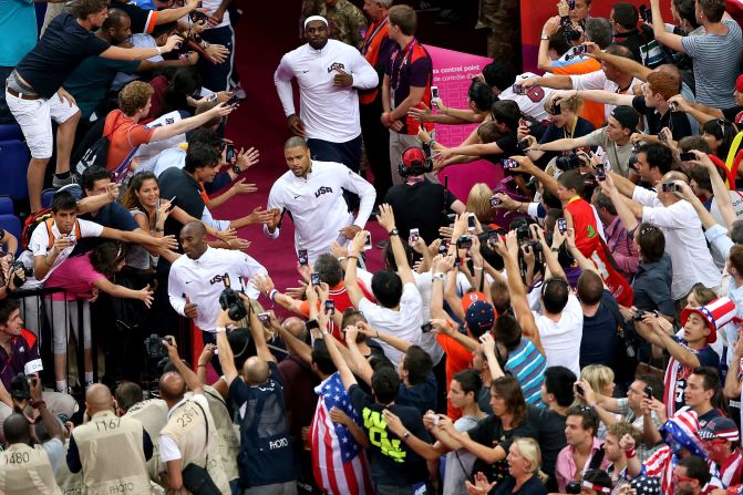 U.S. basketball players Kobe Bryant, Tyson Chandler and LeBron James head to the court before the start of the men's basketball gold medal game against Spain.