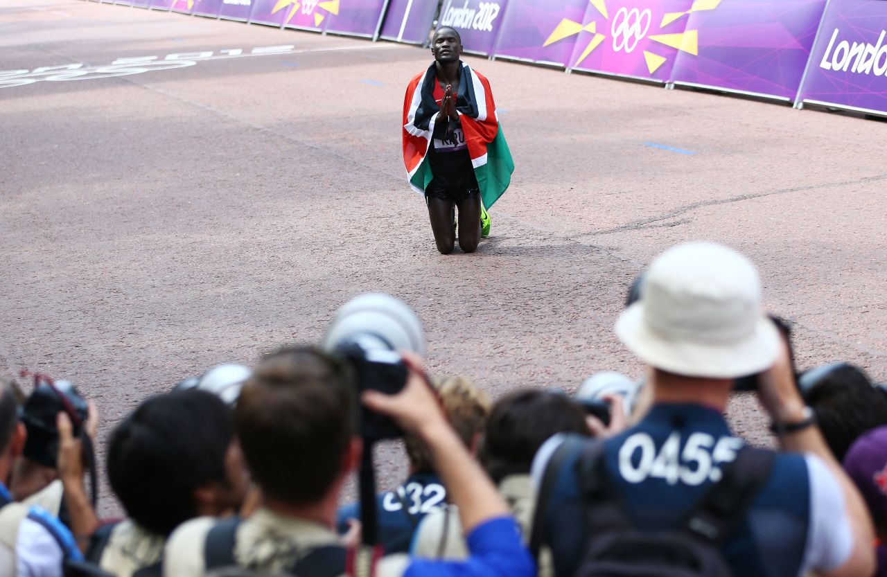 Abel Kirui of Kenya gives thanks after winning the silver medal in the men's marathon at The Mall in London.