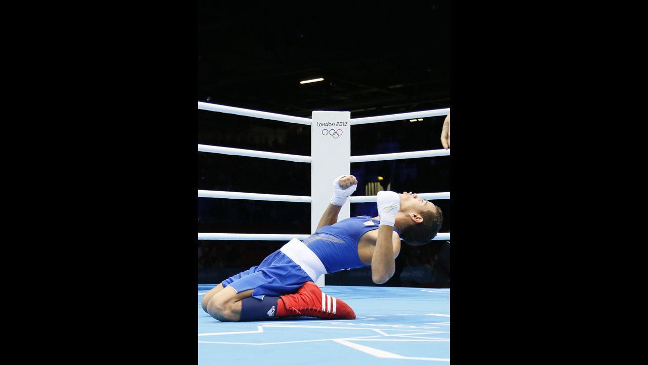 Robeisy Ramirez Carrazana of Cuba celebrates winning the gold medal by defeating Tugstsogt Nyambayar of Mongolia in the men's boxing flyweight 52-kilogram final match.