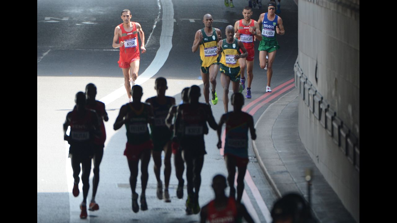 Runners pound the streets of London during the men's marathon. Stephen Kiprotich won the race to give Uganda its first gold medal of the Games.