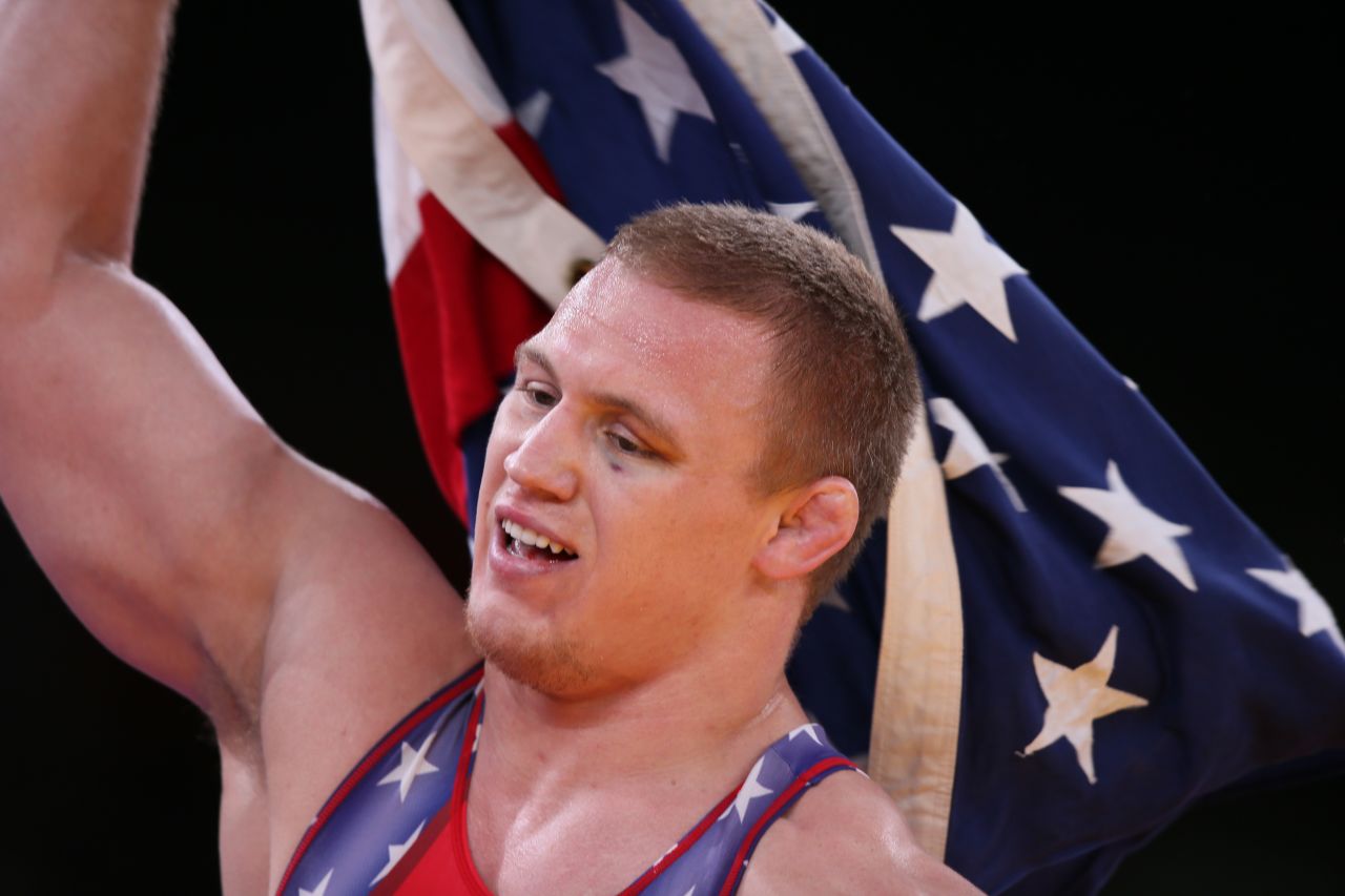 U.S. wrestler Jacob Varner waves the Stars and Stripes after winning the gold medal in the men's 96-kilogram freestyle event on Sunday, August 12.