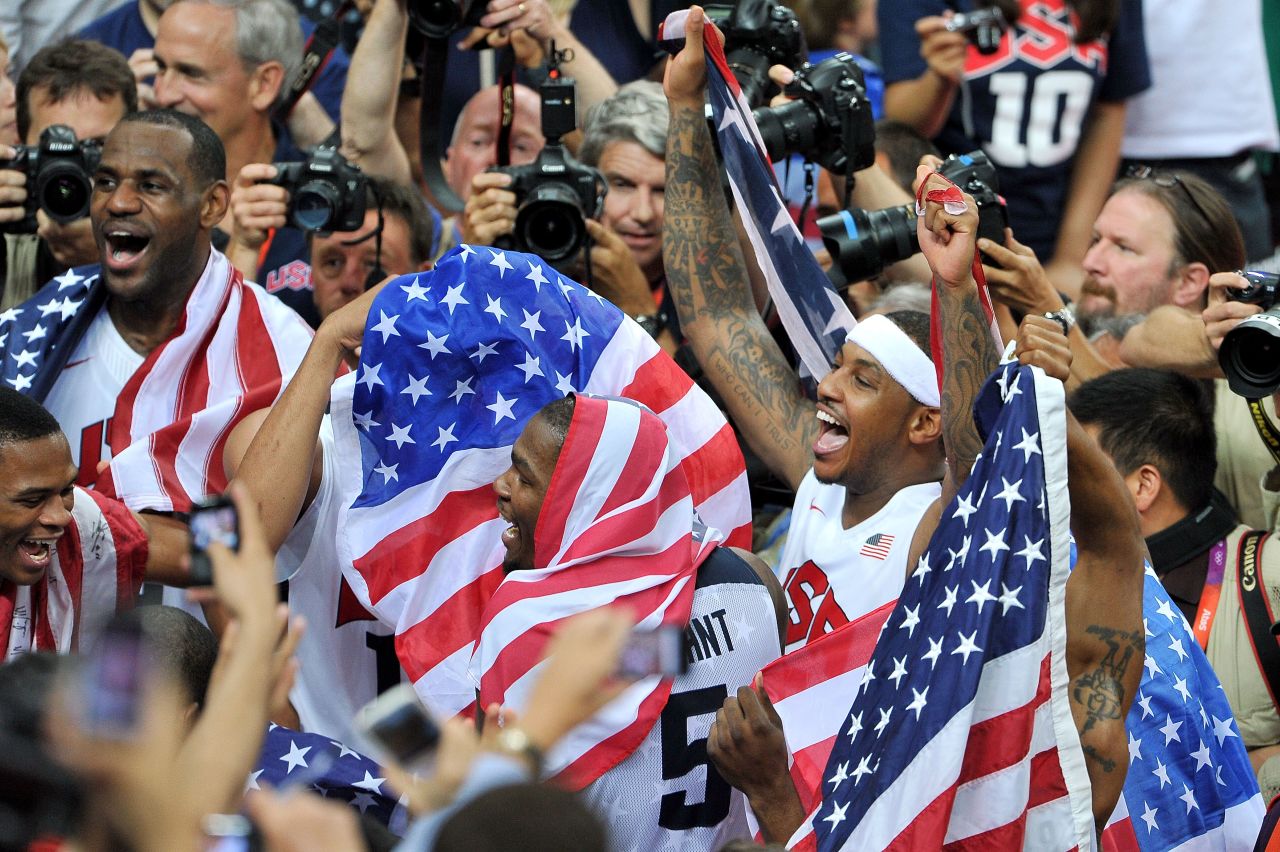 The U.S. men's basketball team celebrates winning the gold medal after defeating Spain on the final day of the London 2012 Olympics on Sunday, August 12.
