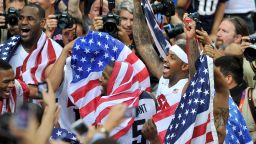The U.S. men's basketball team celebrates winning the gold medal after defeating Spain on the final day of the London 2012 Olympics on Sunday, August 12.