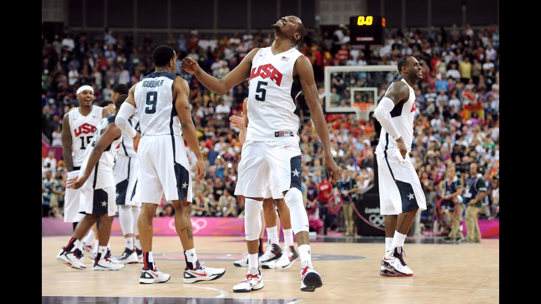 Kevin Durant, center, is triumphant at the end of the gold medal match against Spain on Sunday.