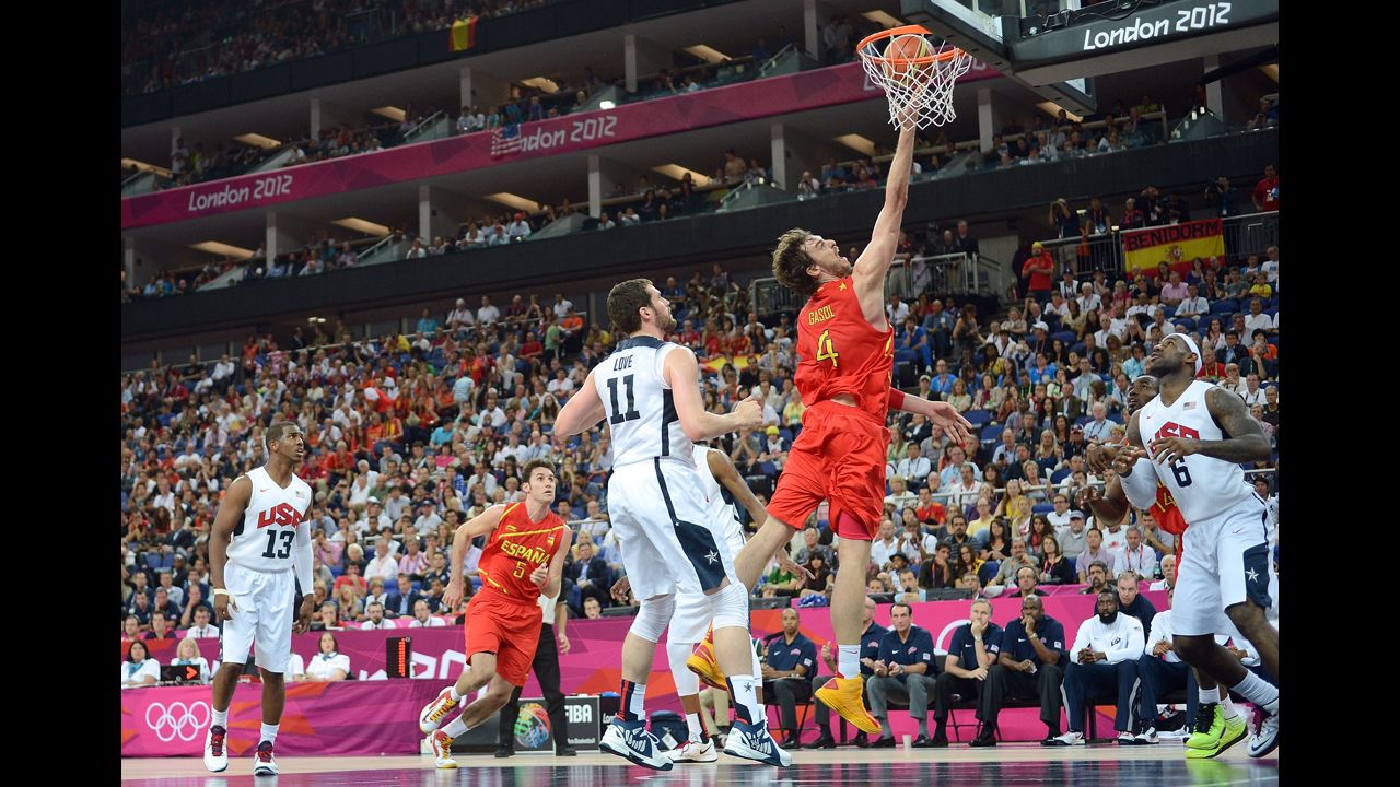 Pau Gasol of Spain drives past Kevin Love of the United States.