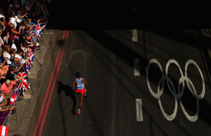 Yonas Kifle of Eritrea is cheered by spectators as he competes in the men's marathon on day 16 of the London 2012 Olympics, Sunday, August 12, the last day of the Games. See all the action as it unfolded here, and <a href="index.php?page=&url=http%3A%2F%2Fwww.cnn.com%2F2012%2F08%2F11%2Fworldsport%2Fgallery%2Folympics-day-fifteen%2Findex.html">check out the best images from day 15 of competition</a> on Saturday, August 11.