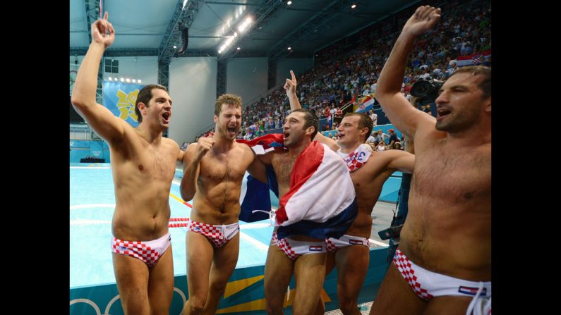 Croatia's Josip Pavic, center, celebrates with his teammates after Croatia defeated Italy in the men's water polo gold medal match.