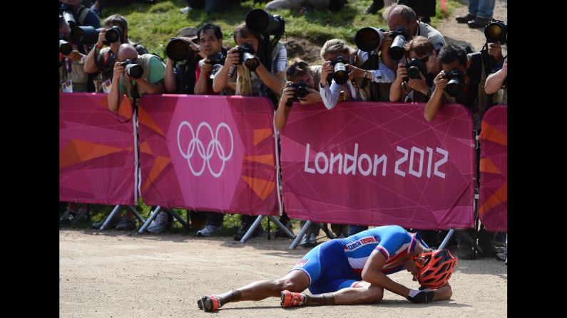 Czech Republic's Jaroslav Kulhavy is overcome by the moment after winning the men's cycling cross-country mountain bike race.