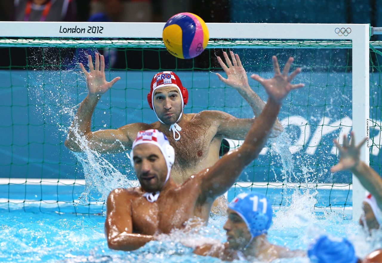 Goalkeeper Josip Pavic of Croatia makes a save during the men's water polo gold medal match between Croatia and Italy.