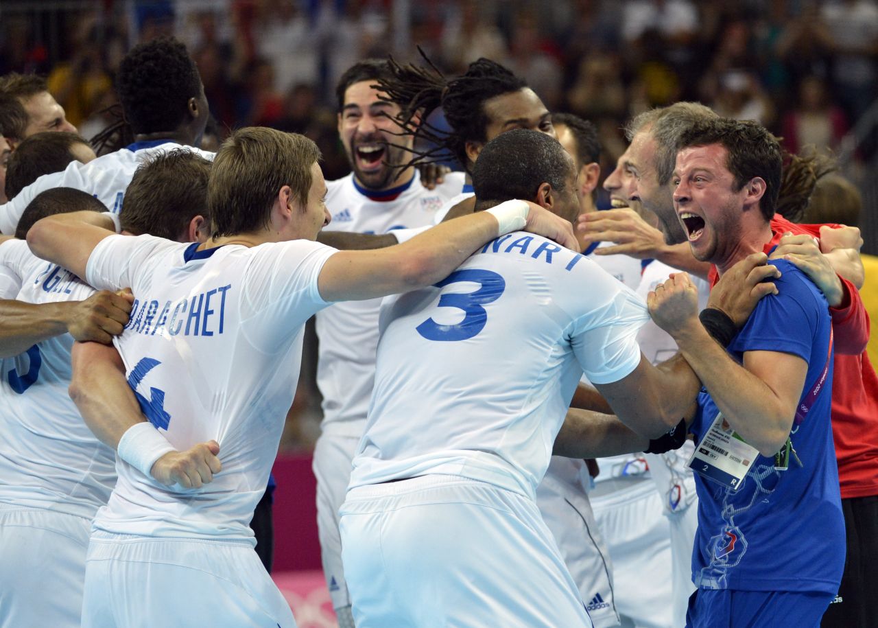 France's players are joyous after winning the men's gold medal handball match between Sweden and France.