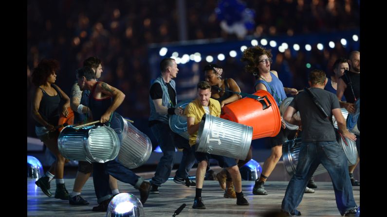 Members of the British percussion group Stomp pound trash cans during their performance.
