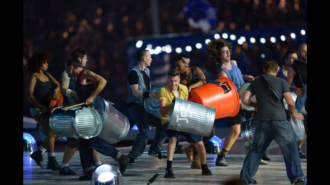 Members of the British percussion group Stomp pound trash cans during their performance.