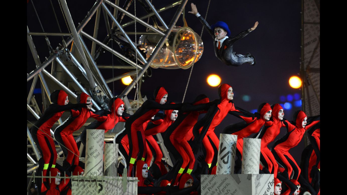 Artists perform at the Olympic stadium.