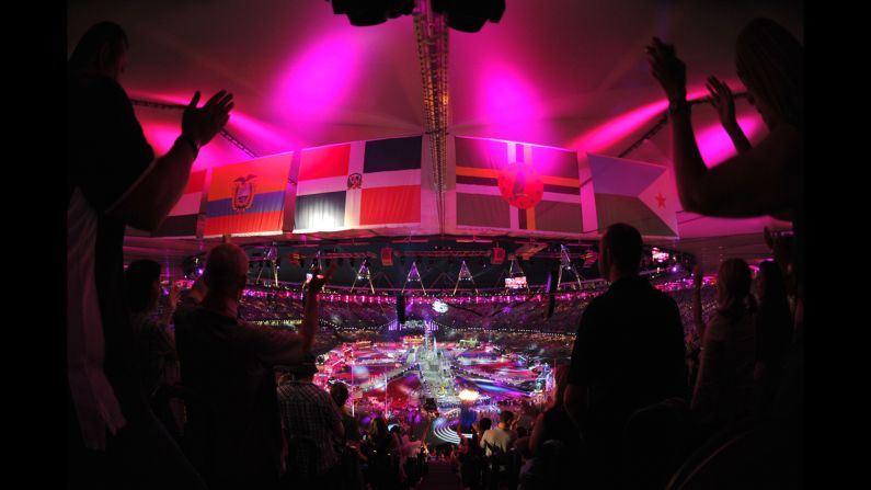 Spectators applaud the ceremony from high above the floor.