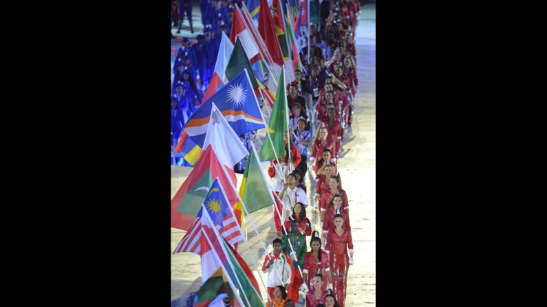 Flagbearers parade during the closing ceremony.