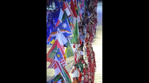 Flagbearers parade during the closing ceremony.