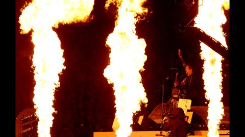 Matthew Bellamy of Muse performs during the closing ceremony.