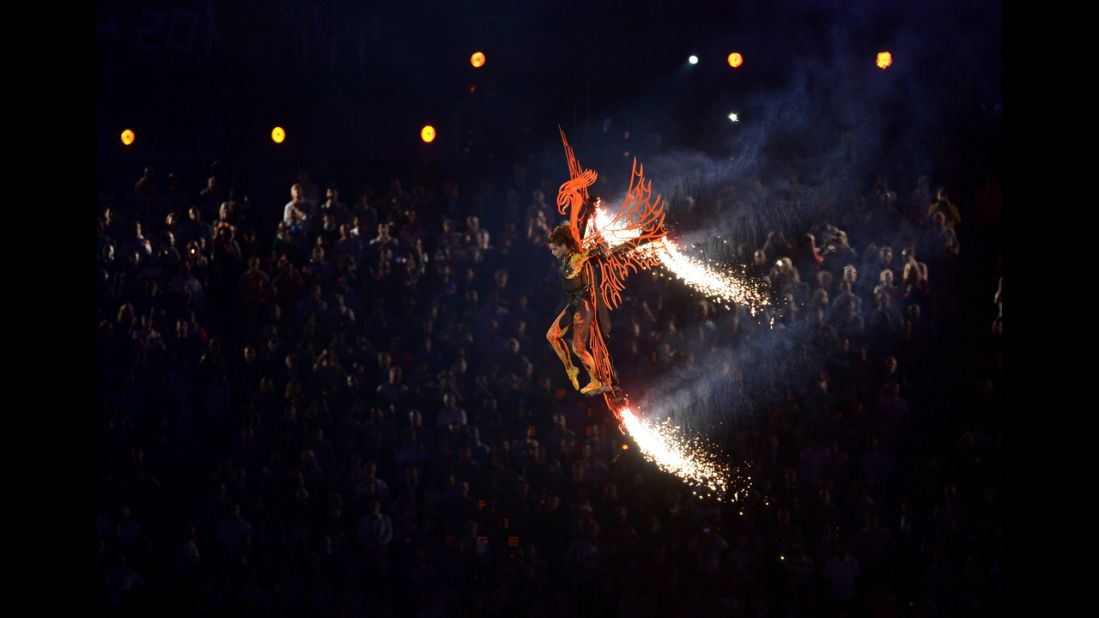 Ballet dancer Darcey Bussell descends into the stadium on a phoenix.