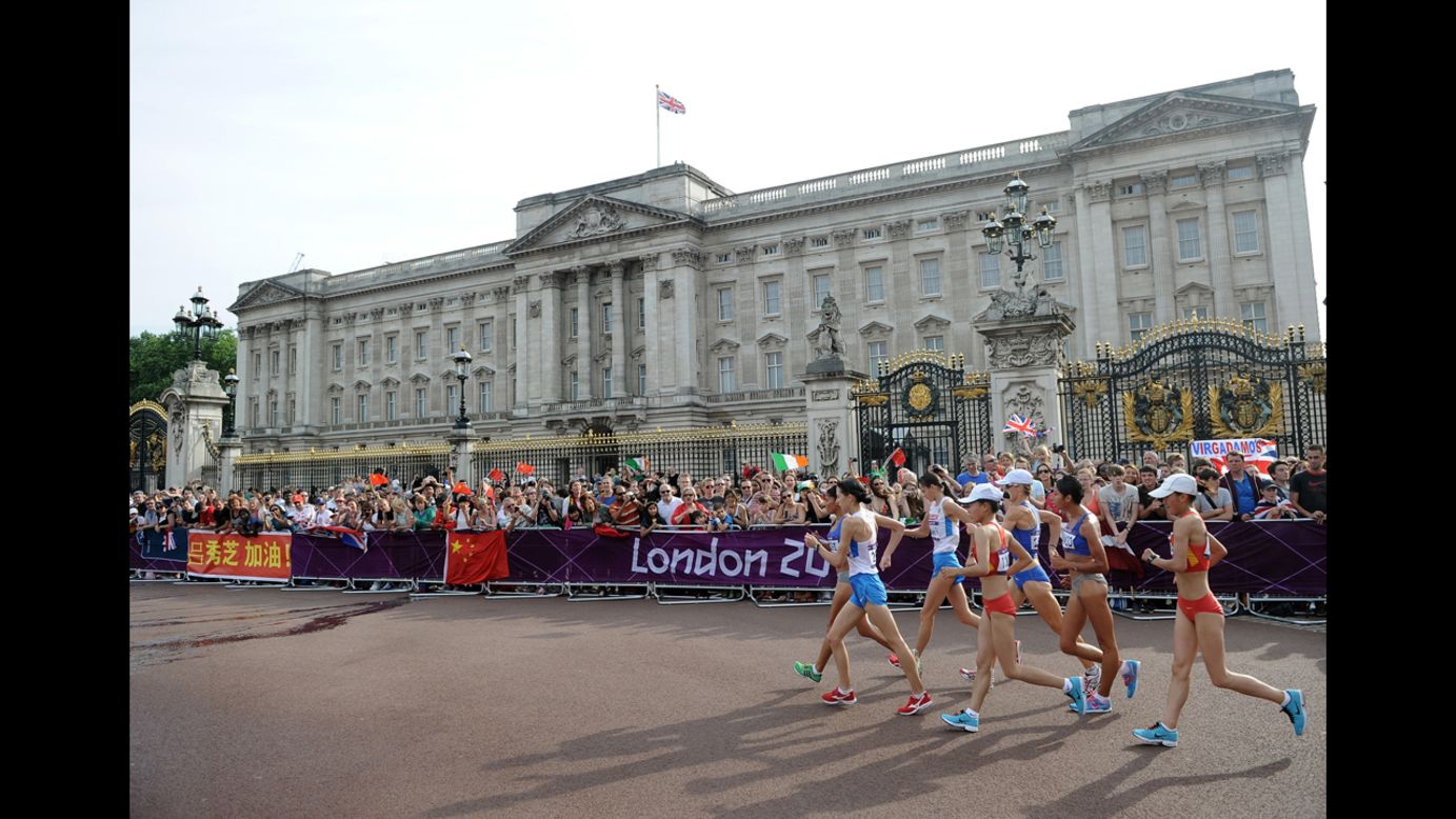 Race walkers compete in front of Buckingham Palace during the Women's 20 km Walk final.
