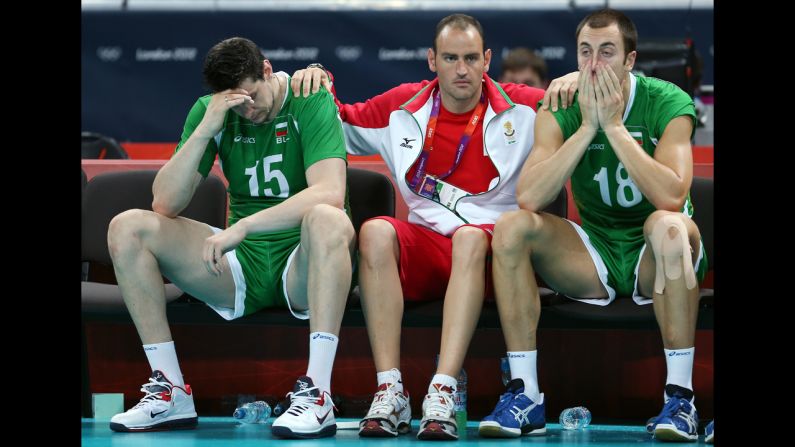 Dejected Bulgarian players look on during their loss to Italy in the men's volleyball bronze medal match.