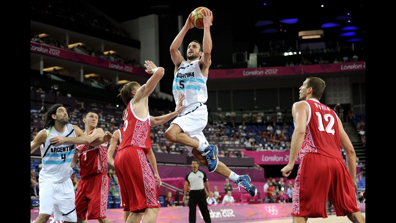 Manu Ginobili, center, of Argentina drives down the lane during the men's basketball bronze medal game against Russia. See photos from the <a href="http://www.cnn.com/2012/08/12/world/gallery/olympic-closing-ceremony/index.html" target="_blank">closing ceremony.</a>