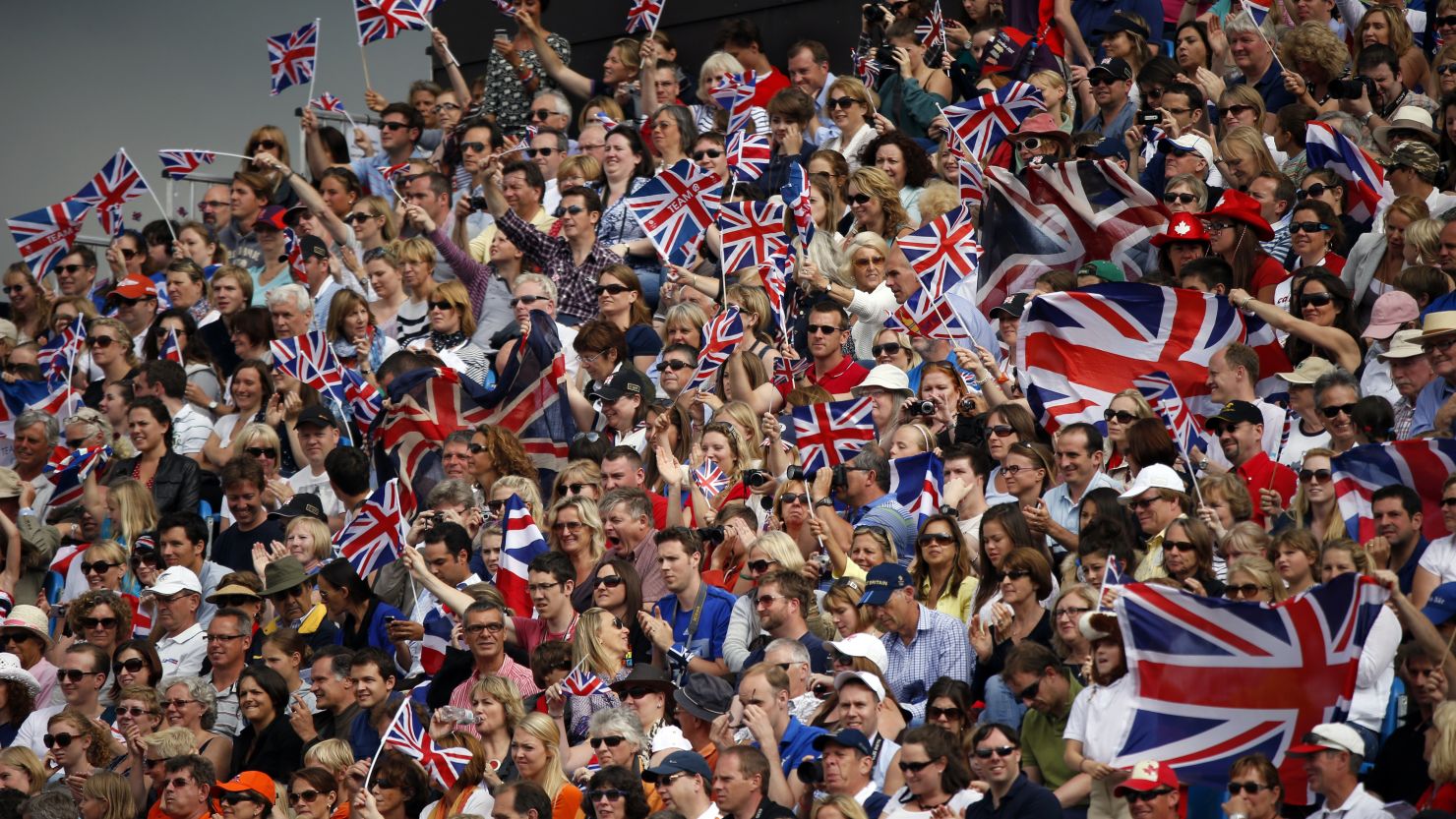 A sea of Team GB's union flags greet competitors at a London Olympic equestrian event. 