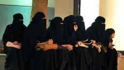 Saudi women wait for their drivers outside a shopping mall in Riyadh on September 26, 2011.