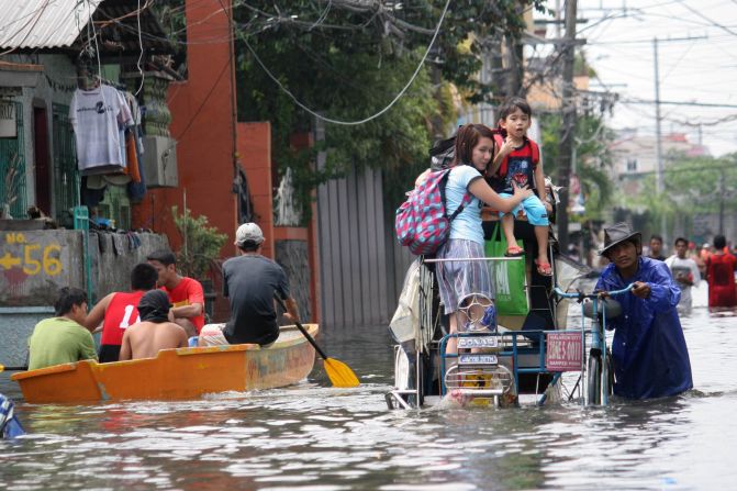 iReporter Reynaldo Cedilla captured this image of the heavy flooding in Manila, Philippines. "Underpasses were not passable to any type of vehicles due to the high water level. In the streets there were waist and knee deep floodwaters. ... Stranded locals tried to wade through it despite the danger," he said.
