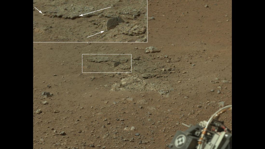 In this portion of the larger mosaic from the previous frame, the crater wall can be seen north of the landing site, or behind the rover. NASA says water erosion is believed to have created a network of valleys, which enter "Gale Crater" from the outside here.