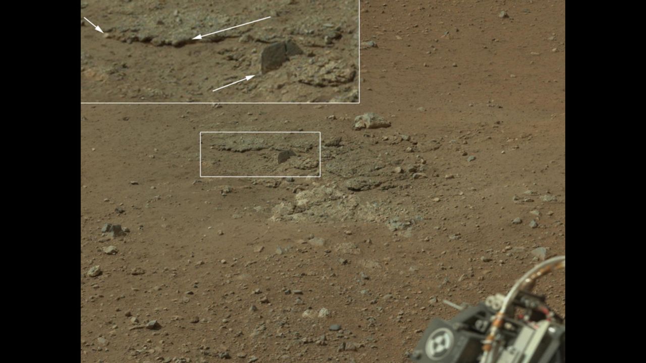 In this portion of the larger mosaic from the previous frame, the crater wall can be seen north of the landing site, or behind the rover. NASA says water erosion is believed to have created a network of valleys, which enter "Gale Crater" from the outside here.