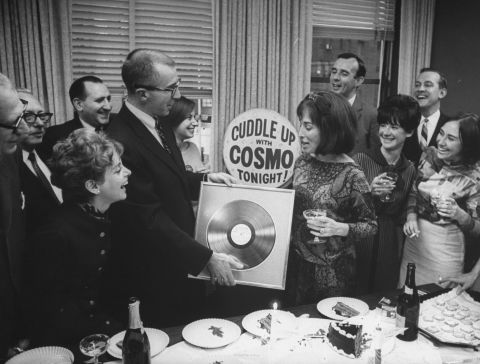 Staffers present Gurley Brown with a gold record at a champagne party celebrating Cosmopolitan's millionth copy in October 1965.