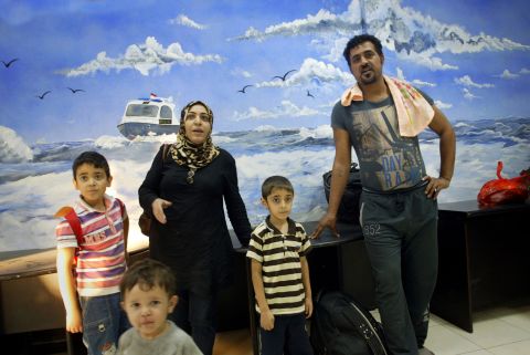 An Australia-bound Iraqi family arrives at an Indonesian marine police station in Surabaya in East Java province on July 29, 2012. They were among a group of 66 Iraqi and Iranian asylum seekers who were rescued from a stricken boat by the Indonesian navy.