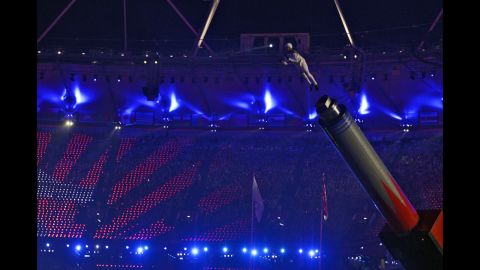 Chachi Valencia, alias The Rocket Man, is propelled in the air at the Olympic stadium.