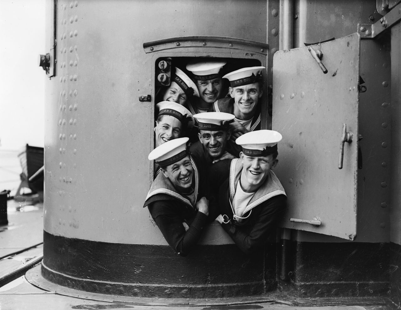 September 1928: A group of sailors on the HMS Hood in high spirits during naval maneuvers.