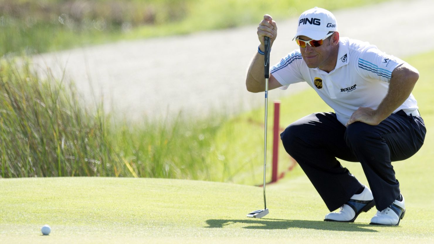 Lee Westwood lines up a putt during a disappointing first round of 75 at Kiawah Island's Ocean Course.